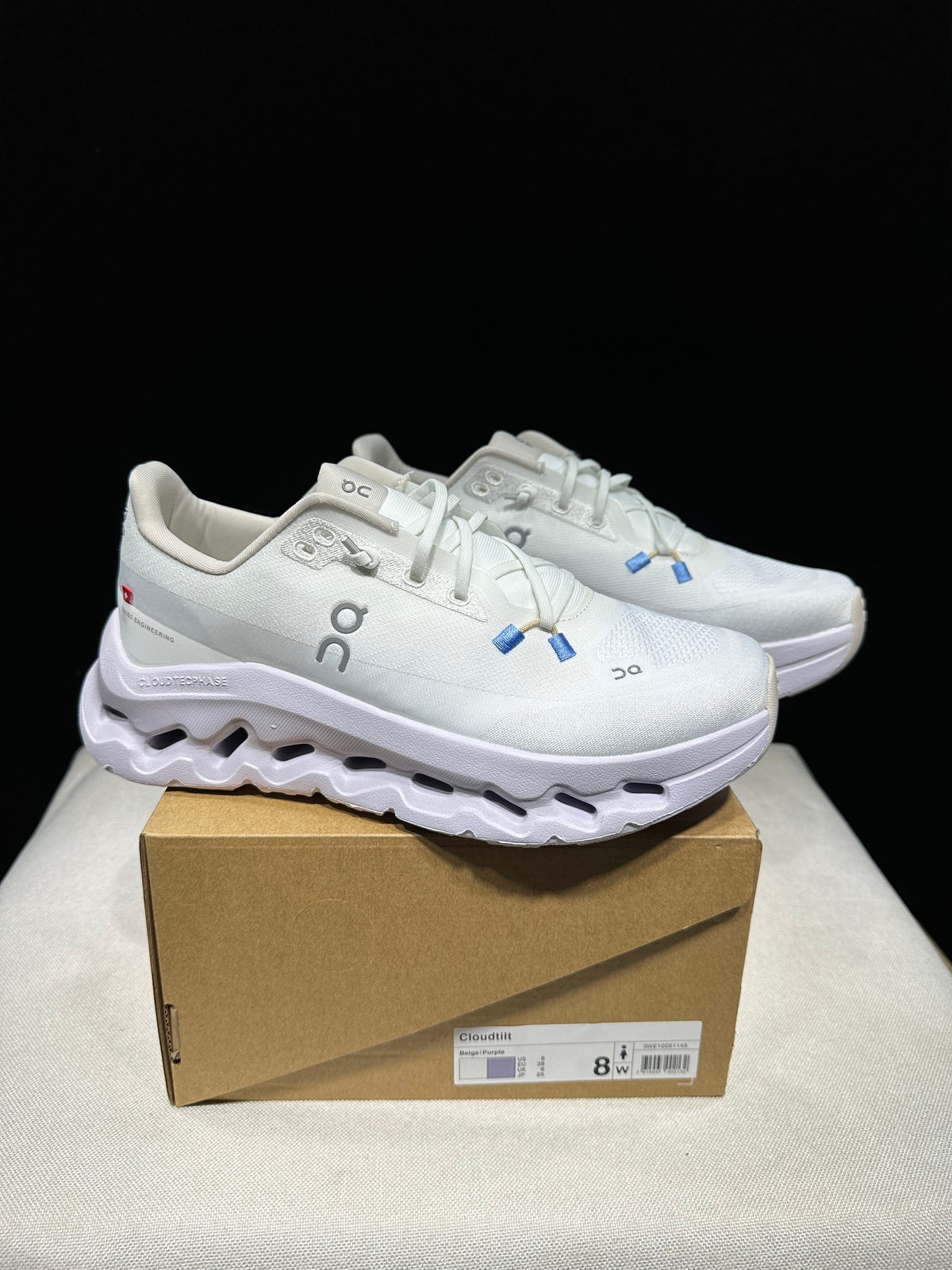 Sneakers with lavender, light grey, khaki, and blue. 