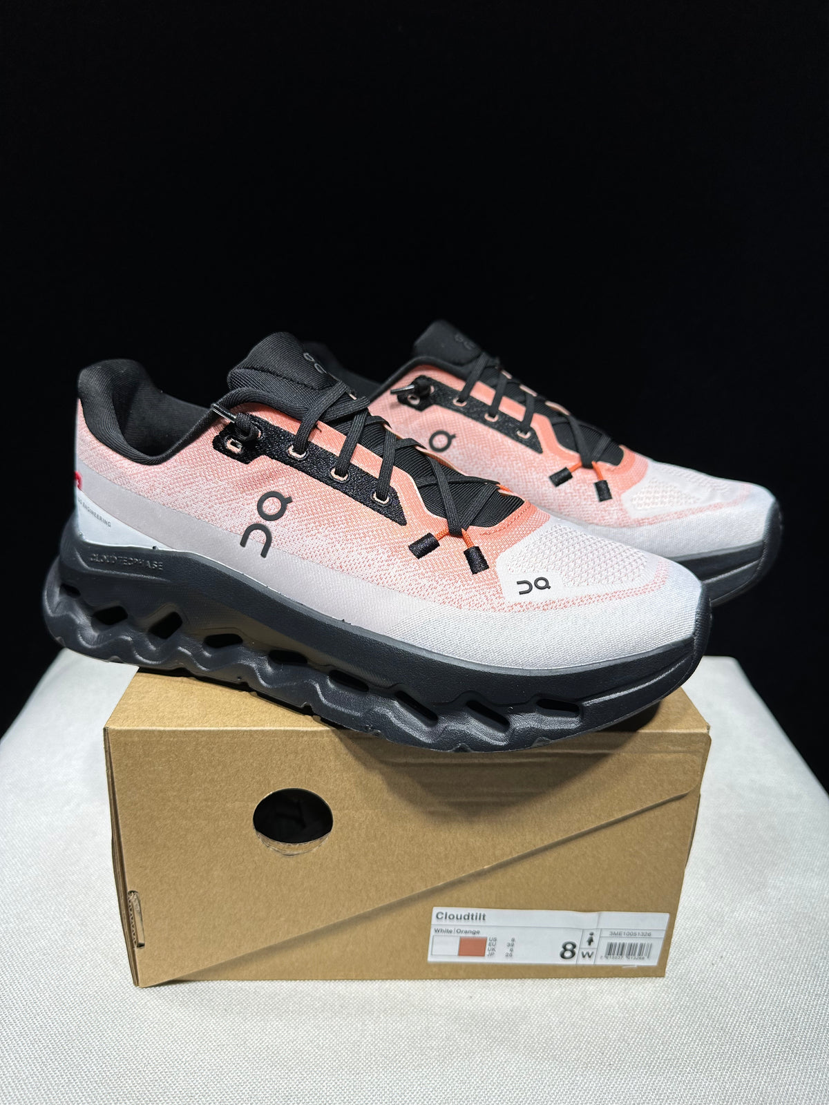 Sneakers with orange & black.