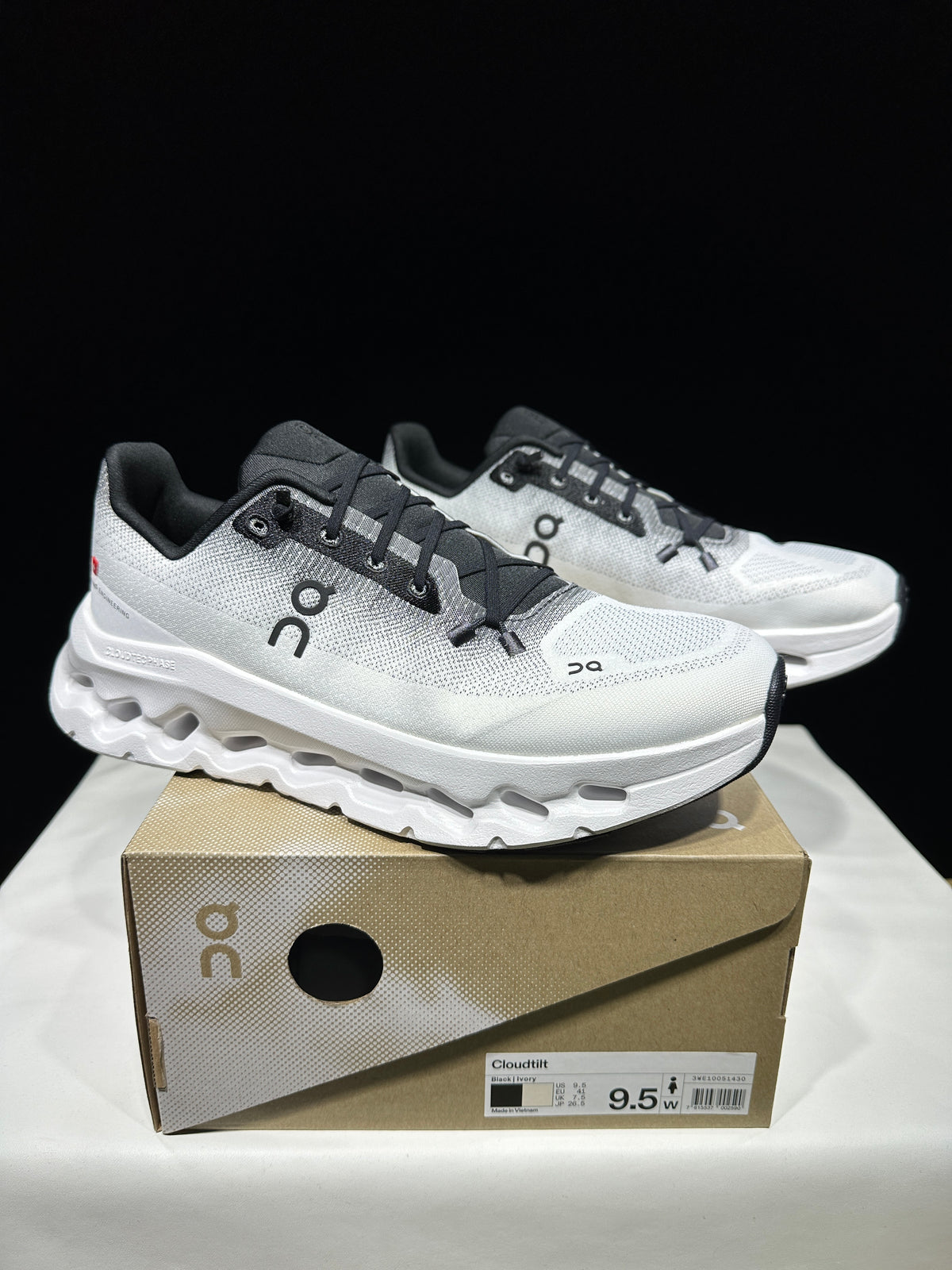 White athletic shoes with black accents.